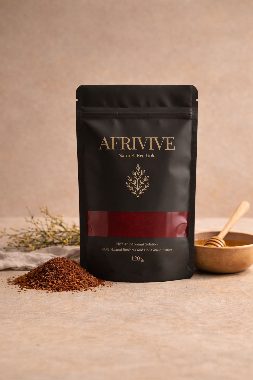 Afrivive packaging with tea grounds and a bowl of honey on a beige background